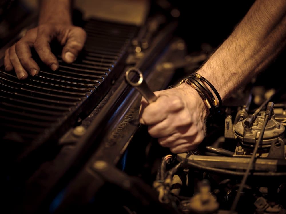Mechanic using a wrench